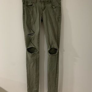 RSQ Army green distressed skinny jeans.